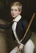  âgé de six ans l'archiduc pose debout tenant une badine