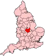 A small county slightly, located in the centre of a country. It is completely bounded by other counties.