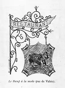Plaque avec la figuration d'un bœuf suspendue à un cadre de rinceaux portant la mention Restaurant
