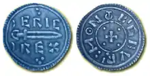 Photo des deux faces d'une pièce de monnaie avec une épée sur une face et une petite croix sur l'autre