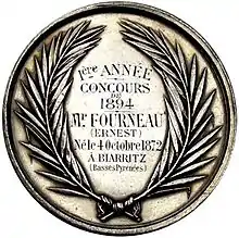 Photographie d'une médaille décernée à Ernest Fourneau.