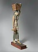 Modèle de porteuse d'offrandes. Bois peint/gesso. Déb. r. Amenemhat Ier, 1981-1975. H. 112 cm. Met