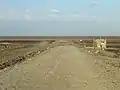 Fin de la route ouvrant sur le désert (2014).