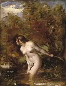 femme nue debout dans un ruisseau