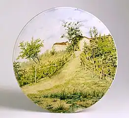 Plat à décor de paysage, Giuseppe Ghinassi, Faenza, dernier quart du XIXe siècle.