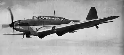 Photographie en noir et blanc d'un bombardier en vol