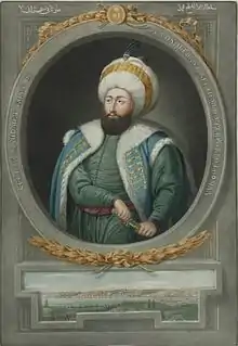 Photographie du portrait d'un homme portant un turban.