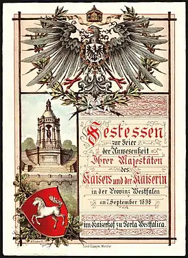 Première page du menu pour le banquet en l'honneur de la présence de Guillaume II (empereur allemand) et de Augusta-Victoria de Schleswig-Holstein-Sonderbourg-Augustenbourg à l'Hotel Kaiserhof (Porta Westfalica) (de) le 7 septembre 1898. Taille : 26 cm x 19 cm.