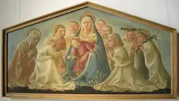 Tableau de la Vierge tenant Jésus dans ses bras, entouré de plusieurs enfants et d'une vieille femme