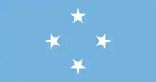 Rectangle bleu clair avec quatre étoiles blanches à cinq bras disposées en cercle