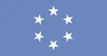 Rectangle bleu foncé avec six étoiles blanches à cinq bras disposées en cercle