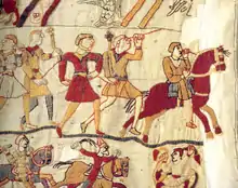 Détail d'une tapisserie montrant des hommes à pied et des cavaliers