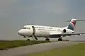 Fokker 70 sur l’aire de stationnement de Quimper (1996).