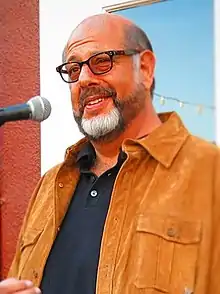 Fred Melamed dans le rôle de William H. Ginsberg