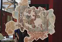Photographie d'une fresque antique reproduisant une scène mythologique