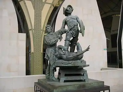 Gérôme exécutant les Gladiateurs. Monument à Gérôme (1909), Paris, musée d'Orsay, groupe en bronze. Morot y a incorporé le groupe original des Gladiateurs, réalisé par Jean-Léon Gérôme en 1878,