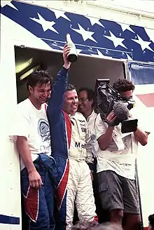 Description de l'image GT2 class winning Luca Drudi & David Donohue - Chrysler Viper GTS-R celebrate in the paddock behind the pits at the 1998 Le Mans (51888334620).jpg.