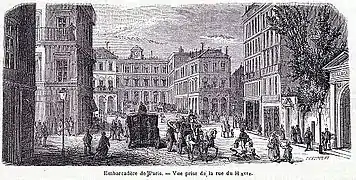 Au fond de l'image, la gare Saint-Lazare vue depuis la rue du Havre.