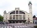 La Gare de Rouen-Rive-Droite, ouverte sous le nom de Gare de la Rue Verte en 1847 et reconstruite de 1912 à 1924 par Adolphe Dervaux, constitue aujourd'hui la gare centrale de Rouen