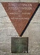 In the Berlin Nollendorfplatz subway station, a pink triangle plaque honors gay male victims.