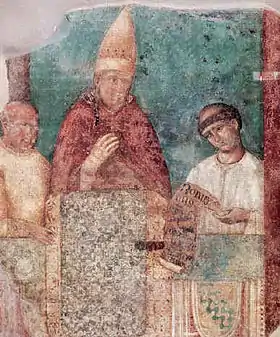 Fresque médiévale montrant un pape (faisant le geste de bénédiction) entouré de deux moines.
