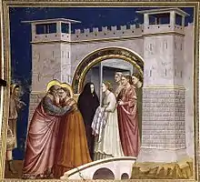 Fresque représentant des personnages regroupés sous une porte de ville et sur un pont, dont deux, auréolés, qui s'embrassent.