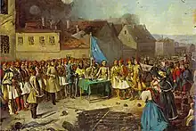 Image représentant des soldats en fustanelle devant des maisons.