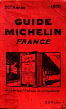 La couverture rouge du Guide Michelin, représentant un panneau qui indique "Carte Michelin".