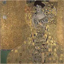 Photographie du portrait, montre Adele Bloch-Bauer recouverte d'or, assise sur un trône également doré.