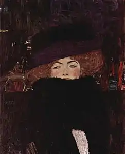 Dame avec un chapeau et un manteau (1909).