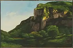 Photographie d'une peinture représentant des falaises entourées de forêts.