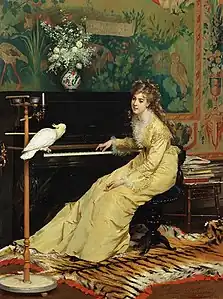 Femme au piano avec un cacatoès.