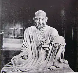  Gyōga. Frontal view of a seated monk with the left leg propped up.