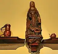 Statue de Sainte Marthe et la Tarasque, dans les cuisines de l'Hôtel-Dieu de Beaune (XVe siècle).