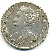 Une pièce de monnaie portant le profil d'une femme corpulente entouré d'une légende en latin
