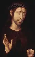 Christ couronné d'épines et levant une main percée en signe de bénédiction.