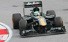 Photographie d'Heikki Kovalainen dans le cockpit de sa monoplace