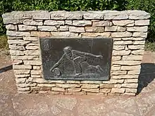 Le bronze représentant Henri Cochet à l'entrée du stade qui porte son nom, à Caluire-et-Cuire.