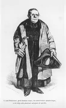 Gravure du portrait en pied d'un prêtre portant soutane et pèlerine avec chapeau dans une main et parapluie dans l'autre