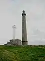 Avec le phare de 1845 (de couleur blanche) en arrière plan.