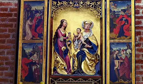Peintures sur un panneau à trois volets encadrés d'or, représentant au centre deux femmes avec un enfant.