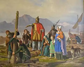 Peinture du dix-neuvième siècle. Au centre, un homme en rouge, entouré de villageois, ordonne à deux hommes de dresser un mât sur la terre, en signe de possession de l'Islande.