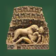Lionne dévorant un homme. Nimroud, British Museum.