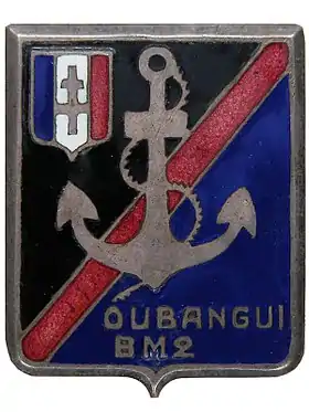 Insigne portant une ancre, les mots "Oubangui BM 2" et un écusson avec la croix de Lorraine.