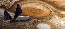 Vue latérale d'un vaisseau spatial à proximité de la Grande Tache Rouge de Jupiter.