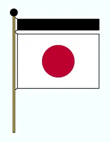 Un croquis du drapeau blanc avec une boule noire. Un ruban noir et une boule noire apparaissent au-dessus du drapeau.