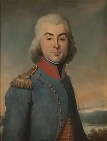 Portait d'un jeune homme aux cheveux blancs vêtu d'un uniforme militaire.