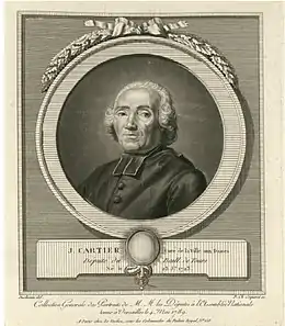 Portrait d'un prêtre catholique portant soutane et cheveux blancs.