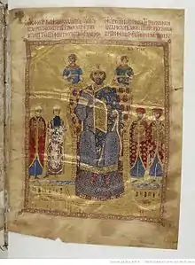 Photo en couleur d'une page de manuscrit montrant un homme couronné habillé en bleu, au-dessus de lui des hommes avec des auréoles, à sa gauche et droite, des hommes portant des costumes riches en couleurs