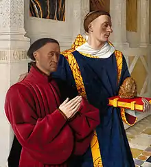 Étienne Chevalier en prière avec à sa gauche saint Étienne tenant un livre et une pierre